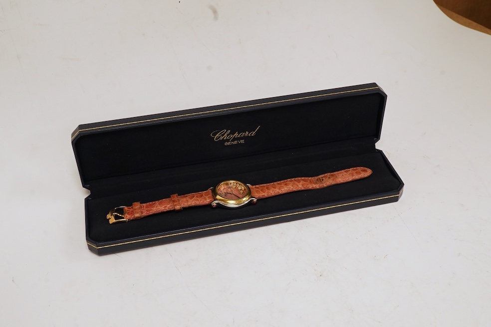 A lady's recent steel and gold Chopard 'Happy Sport' quartz wrist watch, the paua shell dial with seven 'floating' diamonds, on a leather strap wit gold plated Chopard clasp, with box, no papers. Condition - fair